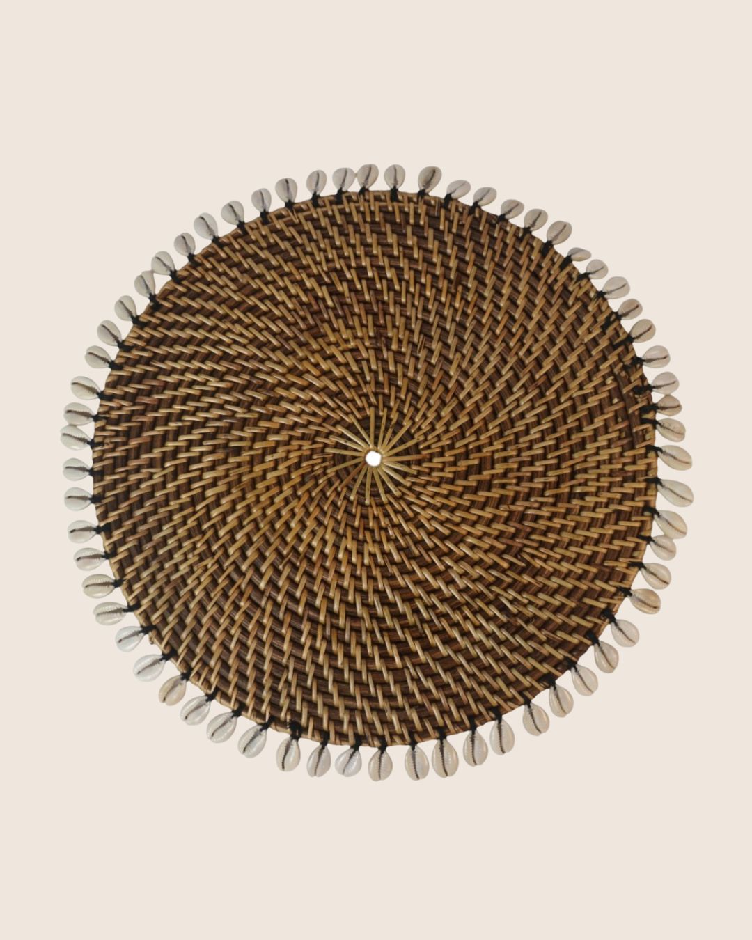 Rattan placemat with cowrie shells
