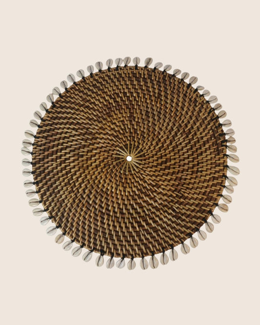 Rattan placemat with cowrie shells